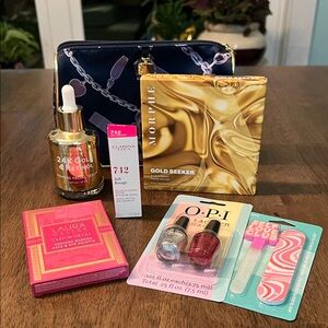 Name brand face and nail bundle includes makeup bag.